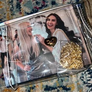 Clear plastic purse with gold strap